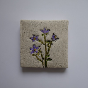 Handmade clay wall picture with bellflower imprint