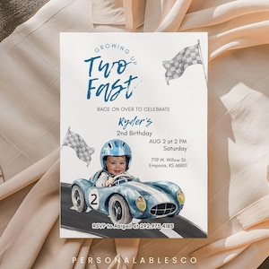 May include: A rectangular birthday invitation card featuring a watercolour illustration of a child in a blue racing helmet driving a blue vintage race car with the number 2. Text includes Growing Up Two Fast, Ryder's 2nd Birthday, and event details.