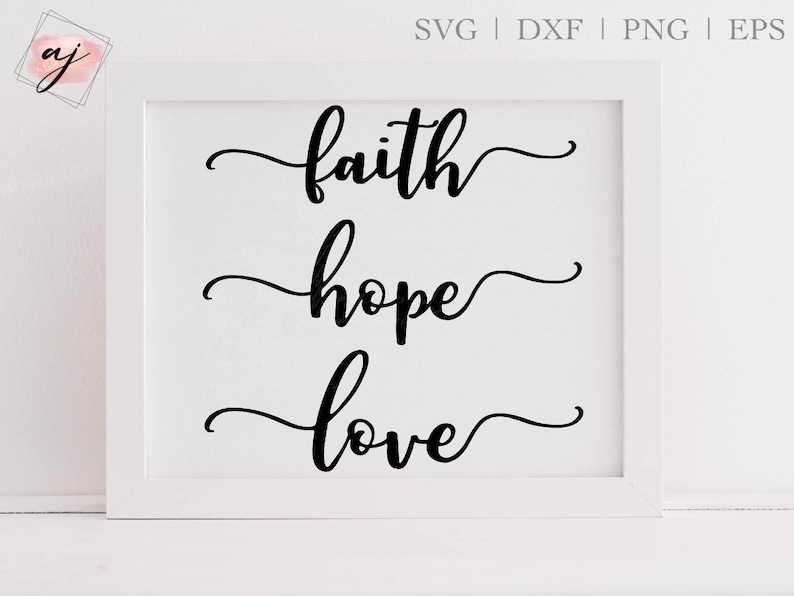 May include: White framed print with black calligraphy that reads "faith hope love" in a cursive font.