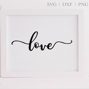 May include: A white frame with a white mat surrounding a black cursive word "love" on a white background.