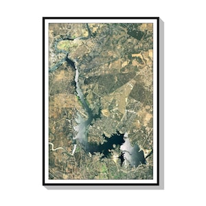 May include: An aerial photograph of a large body of water with a narrow inlet. The water is a dark blue color and the surrounding land is a mix of green and brown.