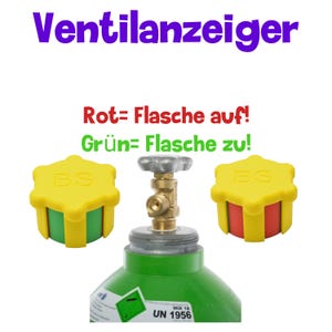 May include: A yellow and green valve indicator for a gas cylinder. The indicator has the text "BS" on it. The text "Rot= Flasche auf! Grün= Flasche zu!" is visible in the image.