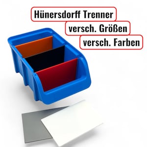 May include: A blue plastic organizer with three compartments, each holding a different colored divider: orange, black, and red. The text "Hünersdorff Trenner" is displayed above the organizer, with "versch. Größen" and "versch. Farben" below it. Two gray and white dividers are in front.