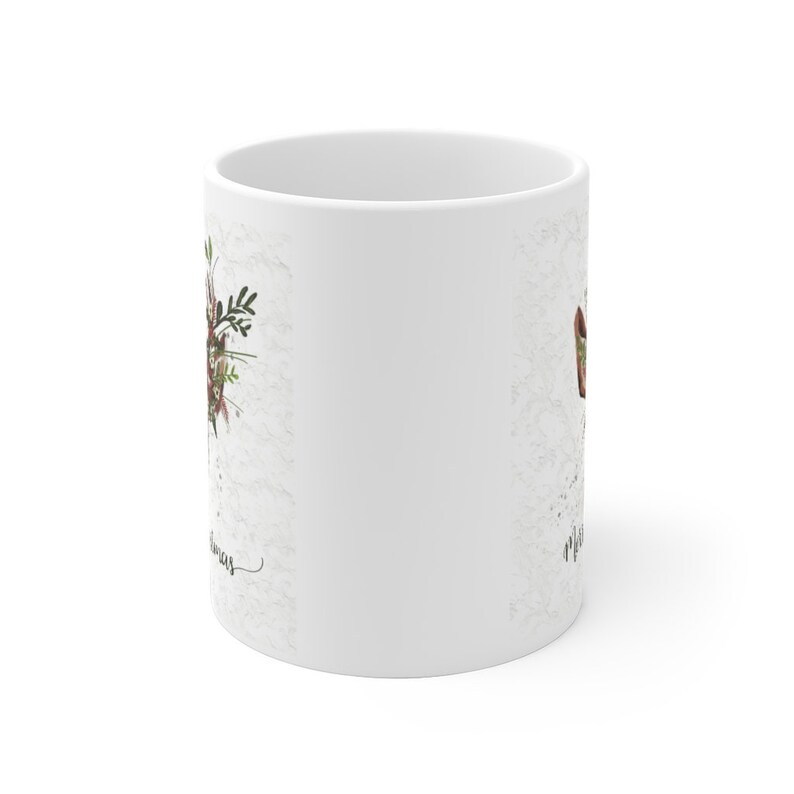 May include: White ceramic mug with a floral design and the text "Merry Christmas" on the side.