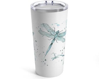 May include: A white stainless steel tumbler with a blue watercolor dragonfly design. The tumbler has a lid and is perfect for keeping drinks cold or hot.