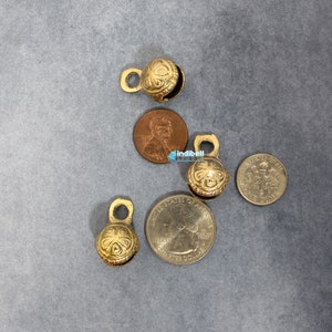 Not only do these small brass sleigh bells offer a rustic allure, but they also serve as versatile accessories for various creative endeavors.