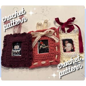 May include: Three handmade crochet picture frames in burgundy, coral, and cream. Each frame holds a small photo and is adorned with decorative ribbons and lace. The words "crochet pattern" are written in a script font.