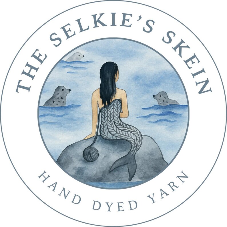 May include: Circular logo with the text "The Selkie's Skein Hand Dyed Yarn." The image features a mermaid sitting on a rock with seals in the water. The mermaid has a knitted tail and is holding a ball of yarn.