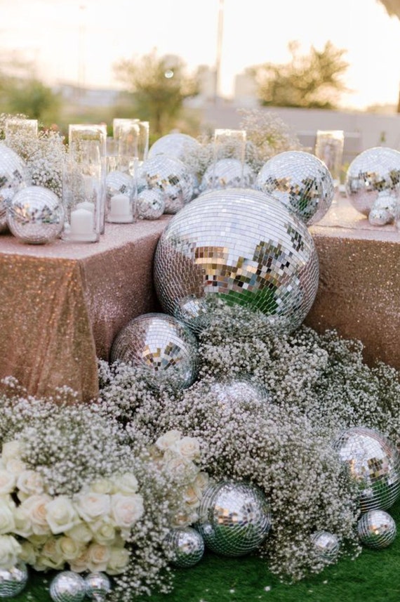 Premium Photo  Disco balls for decorationof a party on pink