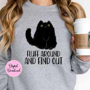 May include: Gray sweatshirt with a black cat illustration and the text "Fluff around and find out".