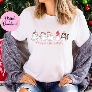May include: White t-shirt with a "Meowy Christmas" design. The shirt features cartoon cats in Christmas hats and decorations. A pink circle with the words "Digital Download" is in the upper left corner.