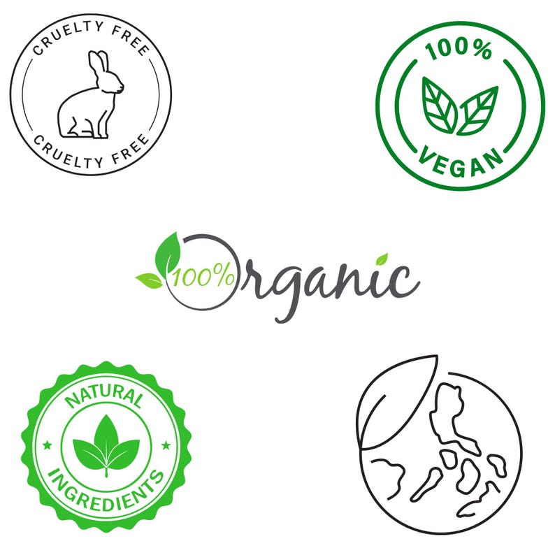 May include: Five green and black circular labels with text and images. The labels are for cruelty-free, vegan, organic, natural ingredients, and a globe with a leaf.