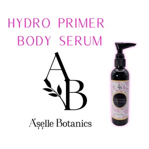 May include: A clear bottle of Hydro Primer Body Serum by A'selle Botanics. The bottle has a black pump top and a label with pink flowers and the brand's logo.
