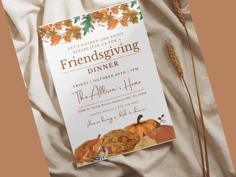 May include: A white invitation card with a fall theme. The card has a watercolor illustration of autumn leaves and a handwritten invitation to a Friendsgiving dinner. The text reads "Let's gather and enjoy, please join us for a Friendsgiving Dinner, Friday October 30th 7PM, The Allison's Home, 9288 W. North Street, Harleysville, PA 19438, Louella Allison 678-719-6987, please bring a dish to share."