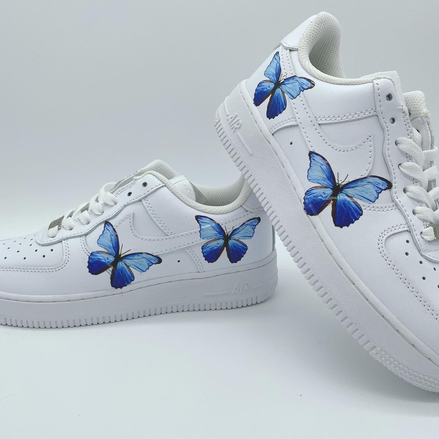 white air force ones with butterflies