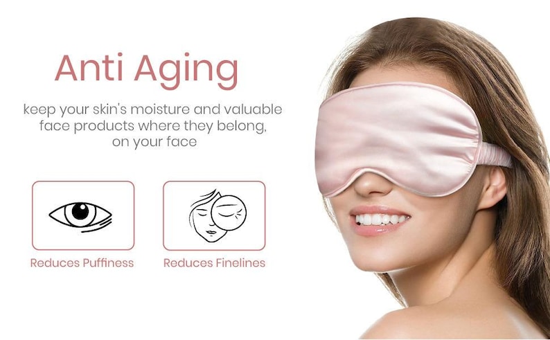 May include: A pink silk sleep mask worn by a woman with a white background. The text "Anti Aging" is above the woman's head. The text "keep your skin's moisture and valuable face products where they belong, on your face" is below the woman's head. Two icons are below the text, one showing an eye with the text "Reduces Puffiness" and the other showing a face with the text "Reduces Finelines".