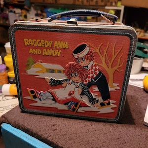 Antique Raggedy Ann and Andy Metal Lunch Box Thermos is 1978