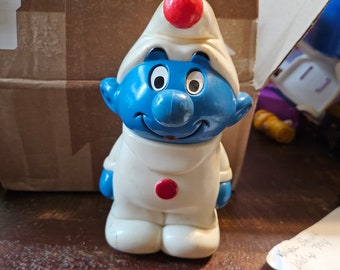 Two antique smurfs wind up and spin around game#362