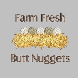 May include: Farm Fresh Butt Nuggets text with a brown font on a light gray background.  Four brown and white eggs are in a nest of yellow hay.