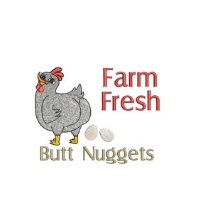 May include: A cartoon gray hen with red wattle and yellow feet lays two white eggs. The text "Farm Fresh Butt Nuggets" is below the hen and eggs.