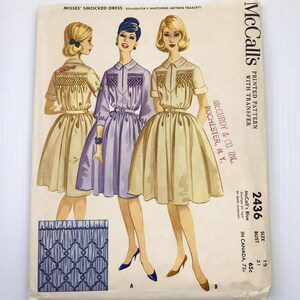 May include: Vintage McCall's sewing pattern for a smocked dress, featuring illustrations of three women in different colored dresses. The pattern includes a matching design for a daughter's dress. The pattern number is 2436, with a bust size of 31 inches.