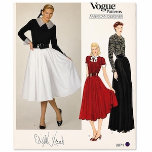 May include: Vogue Patterns American Designer sewing pattern 2871 by Edith Head. The envelope features a photograph of a black long-sleeved top with a grey collar and cuffs paired with a white full skirt, plus illustrations of two dress variations.
