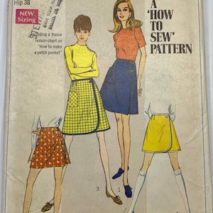 May include: Vintage Simplicity sewing pattern 7498, featuring illustrations of wrap skirts. The pattern includes instructions for making a patch pocket. The text on the pattern reads "A 'How to Sew' Pattern". Waist sizes range from 22 to 31 inches.