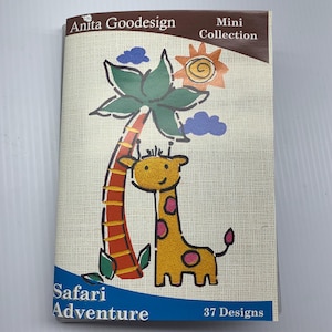 May include: A booklet titled "Anita Goodesign Mini Collection" with a "Safari Adventure" theme. The cover features a cartoon giraffe, palm tree, sun, and clouds. The booklet has 37 designs.