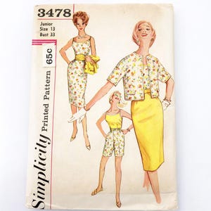May include: Vintage Simplicity printed sewing pattern featuring illustrations of women's outfits. The pattern includes a dress, shorts, and a jacket, all with floral designs. The pattern is for a Junior size 13, with a bust size of 33 inches.