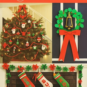 May include: A festive Christmas-themed image featuring a decorated tree, a wreath with a bell, and stockings. The tree is adorned with ornaments and red garland. The wreath has a red bow. The stockings are red, white, and green, with letters.