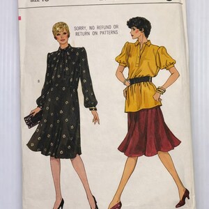 May include: Vogue Patterns sewing pattern, size 16, with illustrations of two women's outfits. One is a black dress with a floral pattern, and the other is a yellow top with a burgundy skirt. The pattern's text includes "Sorry, no refund or return on patterns."