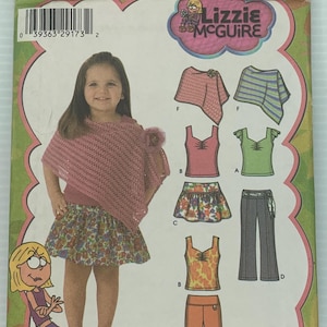 May include: Simplicity sewing pattern featuring a young girl wearing a pink crocheted poncho, floral skirt, and other clothing options. The pattern includes the text "Lizzie McGuire" and "Watch it on Disney abc Kids".