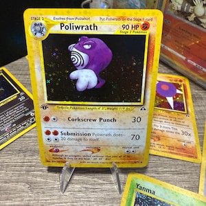 holographic poliwrath pokemon card value Lv.45 No.062 Old Back Holo Rare Very Good Japan proof acrylic case and featuring a striking image of the captivating character Poliwrath - SV06: Twilight Masquerade