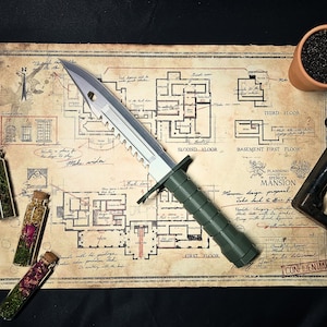 May include: A silver knife with a black handle and a serrated blade. The knife is lying on a map with a floor plan of a mansion. The map is labeled "Planning of Spencer Mansion" and includes the text "Take back & offer for update. Changing is permitted with first approval only. Don't just make the content... CONFIDENTIAL".