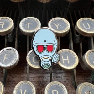 Resident Evil HUNK 1&quot; Enamel Pin