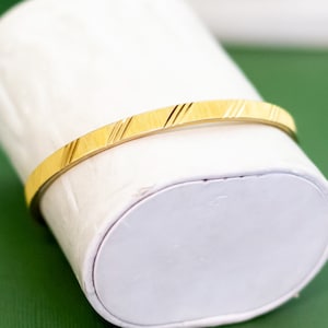 7 inch, Vintage Line Stripes Gold Tone Bangle by Monet - K44