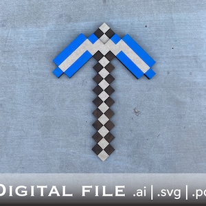 May include: A blue and black wooden Minecraft pickaxe. The pickaxe is made of individual blocks and has a checkered pattern.