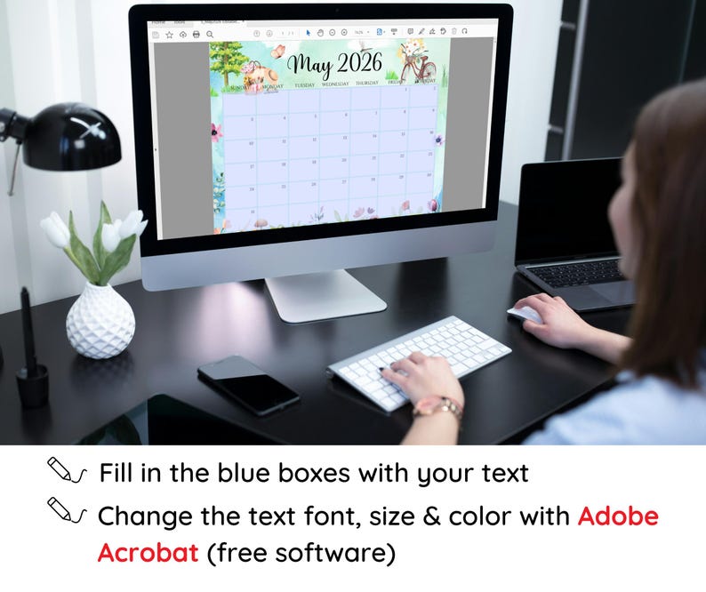 May include: A computer monitor displays a May 2026 calendar with a floral and bicycle design. The text on the screen includes "May 2026" and instructions to fill in blue boxes and change text with Adobe Acrobat software.
