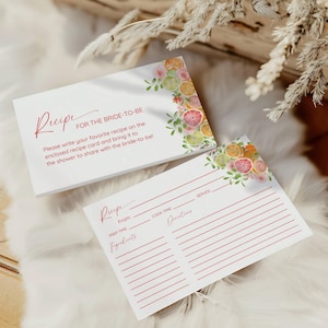 May include: White recipe cards with red script and floral accents. The cards read "Recipe for the Bride-to-Be" and include space for ingredients, prep time, and directions. The cards are decorated with watercolor citrus and floral designs.