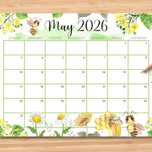 May include: A decorative calendar for May 2026, featuring a green grid layout with illustrations of bees, flowers, and honey. The calendar has the days of the week across the top and dates within the grid.