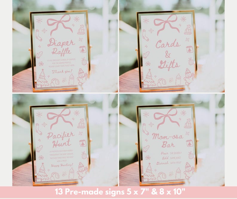 May include: Four framed signs with gold borders and pink text. The signs read "Diaper Raffle", "Cards & Gifts", "Pacifier Hunt", and "Mom-osa Bar". Each sign has a pink bow and winter-themed illustrations. The signs are 5 x 7 inches and 8 x 10 inches.
