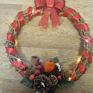 Christmas Decorative wreath with Robin and red ribbon