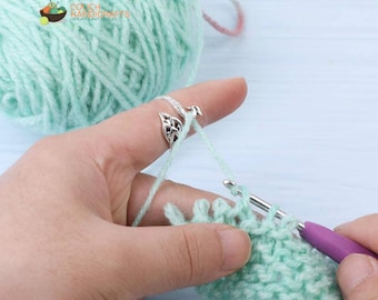 Learn to Crochet with this Adjustable Silver Yarn Guide Peacock Ring for Crocheting and Knitting Yarn