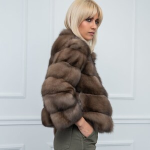 Lavander Sable Fur Cropped Jacket Side. A genuine sable fur jacket with side pockets. It has a regular fit and is produced by Shopifur