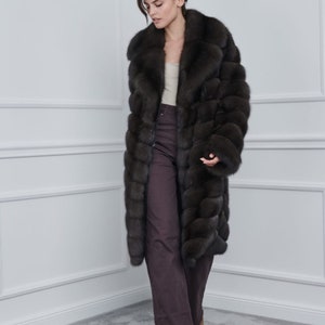 Sable Lutezia Coat With Rever Collar Front.  A sable coat made of natural fur. It is made of the best leathers on the market. It has side pockets and has a regular fit. Top quality sable