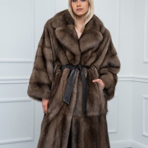 Platinum Sable Relaxed Fit Fur Coat Front. Discover our sable collection, exceptional choices only for sable fur lovers, always tailor made for your needs. On the lining every label that indicates the quality and the origin of the skins.