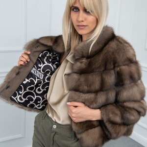 Lavander Sable Fur Cropped Jacket Front. A real sable fur jacket with side pockets. It has a regular fit and is produced in Greece