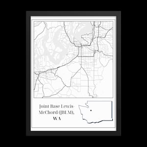 May include: A black and white map of Washington state with a black dot marking the location of Joint Base Lewis-McChord (JBLM), WA.