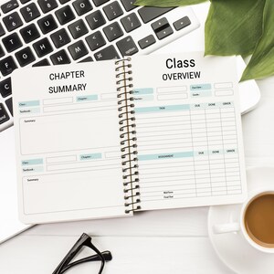 May include: An open spiral bound notebook with two sections, one labeled "Chapter Summary" and the other labeled "Class Overview". The notebook is on a white surface with a laptop, a cup of coffee, and a pair of glasses.