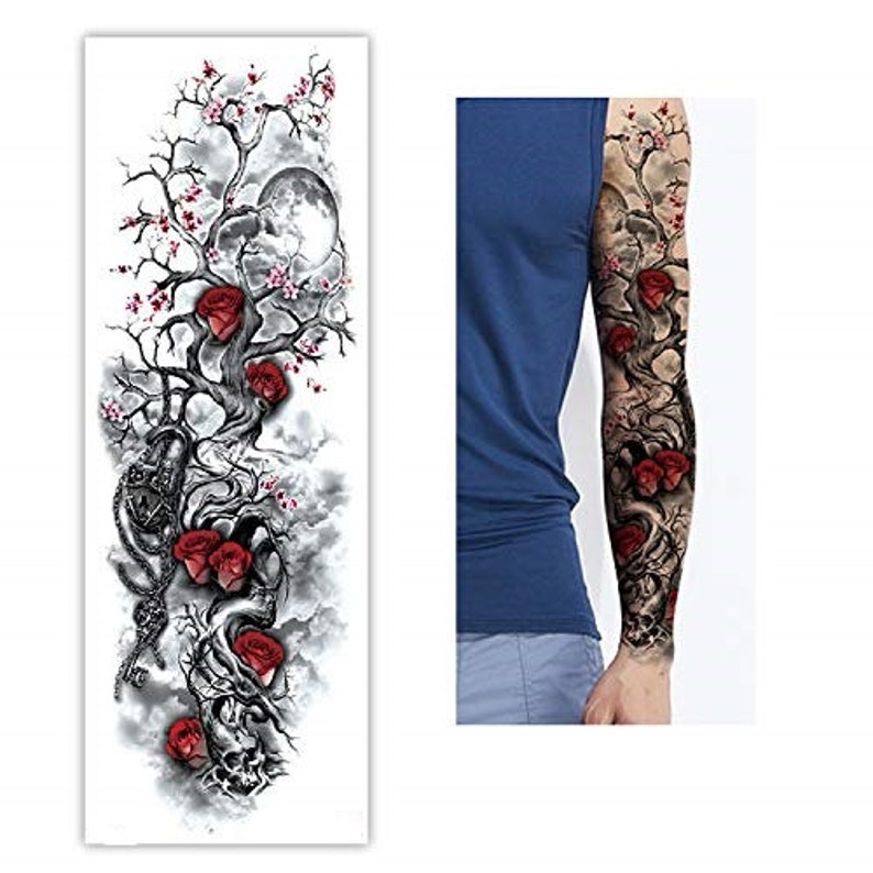 May include: A temporary tattoo design featuring a black and white tree with red roses and a moon. The tattoo is designed to be applied to the arm.